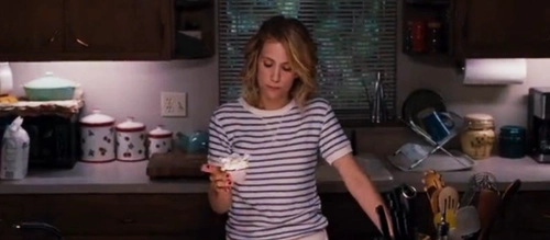 Kristen Wiig bakes a cupcake in 'Bridesmaids' (2011).