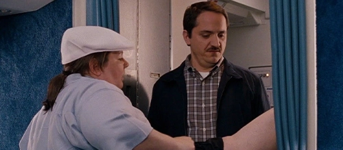 Melissa McCarthy and Ben Falcone on an airplane in 2011 comedy 'Bridesmaids'.